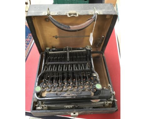 Corona portable typewriter, collapses to fit into its case
