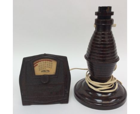 A Bakelite perpetual calendar, Junior together with a Bakelite lamp base (2) 