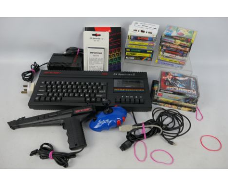 Sinclair - Spectrum. A ZX Spectrum +2 Personal Computer with 19 x casssette games, Manta Ray joy-stick, Sinclair light gun, p