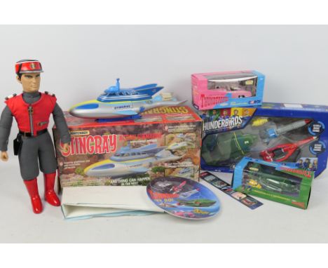 Stingray - Captain Scarlet - Thunderbirds. A selection of 8 boxed and loose items: Vehicles, poster, plate, Action Figure to 