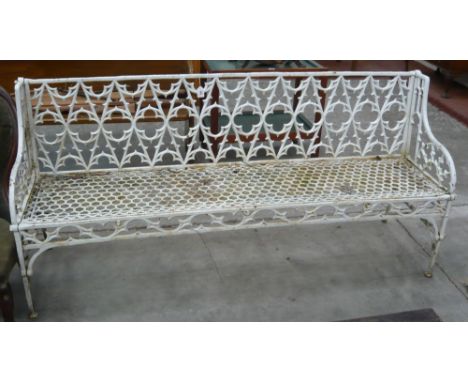 A Victorian heavy cast iron garden bench with gothic patterned back, honeycomb seat in the style of Val d' Osne, 192cm