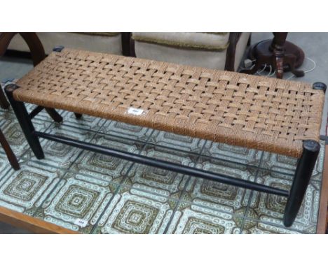 A woven top long stool 
