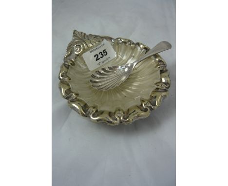 A plated shell butter dish with glass liner together with moulded caddy spoon