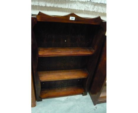 A pine wall hanging three shelf open bookcase, 61cm x 16cm x 96cm high