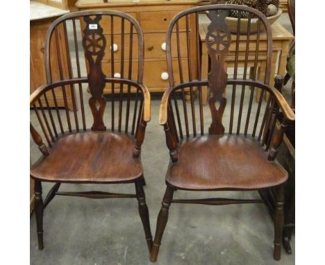 A good pair of hoop back Windsor armchairs with central pierced splat and stick supports
