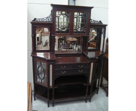 A mahogany chiffonier with raised mirror and cupboards over four short drawers and shelves flanked by glazed cupboards over s