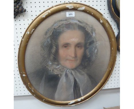 An oval gilt framed portrait depicting Victorian maiden, 42cm x 48cm