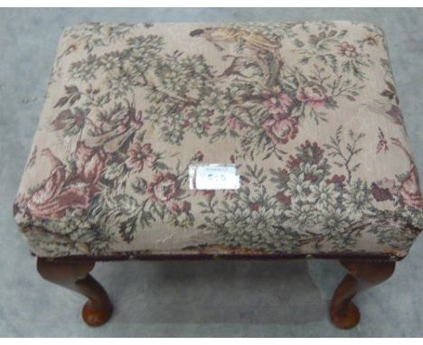 A tapestry upholstered stool on four cabriole legs