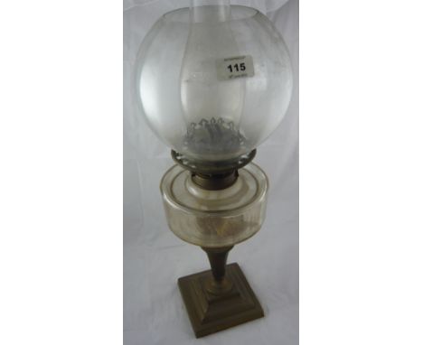 A brass oil lamp with ribbed glass reservoir and shade, 61cm high