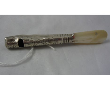 A small silver and mother of pearl whistle