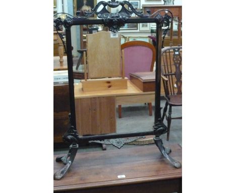 A Victorian moulded brass mirrored firescreen on splayed feet, 92cm high