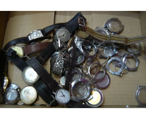 A quantity of vintage wristwatches and cases