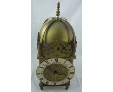 A brass lantern clock with pierced fish grill over silvered and brass chapter ring, movement marked for Japy Freres et Cie 43