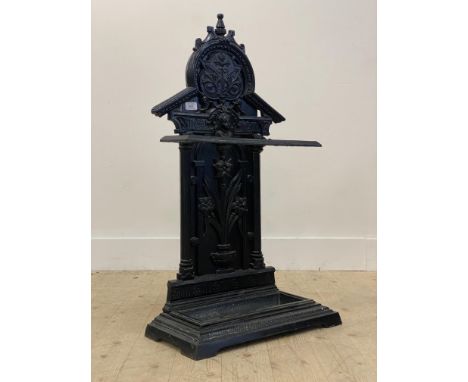 A Victorian cast iron stick stand, the back depicting an urn issuing a bouquet of flowers enclosed by reeded pilasters, lozen