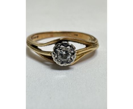 A 18ct gold solitaire diamond ring, mounted in claw set illusion setting of open form, M/N, 3.03g