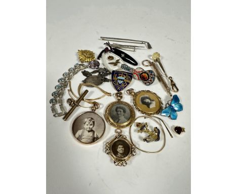 A collection of vintage jewellery including a 9ct gold doubled sided portrait locket with knot pattern border, badges, white 