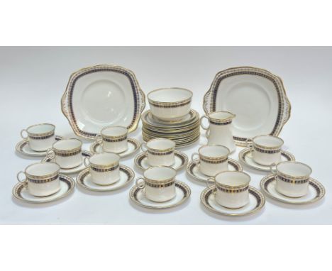 A Royal Albert China part tea service decorated with blue and gilt enamelling comprising two serving plates(25.5cm), a bowl (