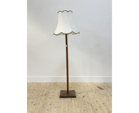 A mid 20th century stained ash lamp standard, the square tapered column raised on a square base, complete with shade H160cm