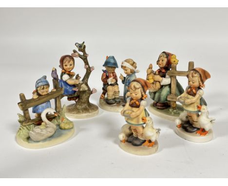 A collection of six German Hummel pottery figures including, Be Patient, Feathered Friends, Little Nurse, Apple Tree Girl etc