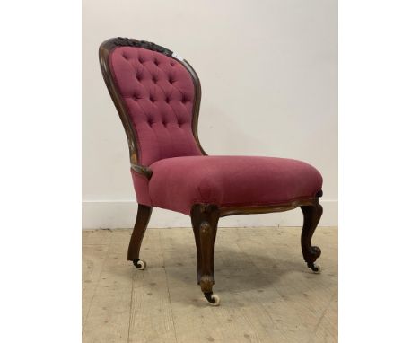 A Victorian walnut framed spoon back slipper chair, acanthus and cartouche carved crest rail above button back and overstuffe