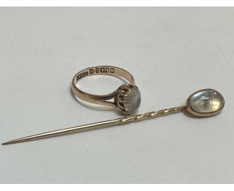 A 9ct gold ring set oval cabouchon Moonstone in claw setting, (L x 0.6cm), Q/R and a 9ct gold stick pin set oval cabouchon Mo