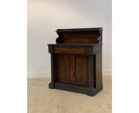 A mid 19th century mahogany Edinburgh pattern chiffonier, the galleried open shelf raised on s scrolled and leaf carved corbe