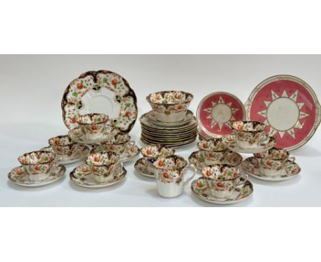 A near complete Duchess China imari pattern tea service comprising ten teacups (chip to rim), twelve saucers (w-14cm), a serv