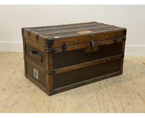 An early 20th century oak bound steamer trunk, the hinged lid opening to a paper lined interior with lift out tray, H52cm, L9