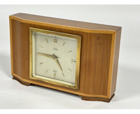 A Elliot blonde mahogany satinwood banded, mantle clock retailed by Laing of Glasgow,  with silver dial and Arabic numbers at