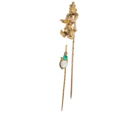 Two 9ct Stick Pins:To include an articulated clown and an emerald and opal example