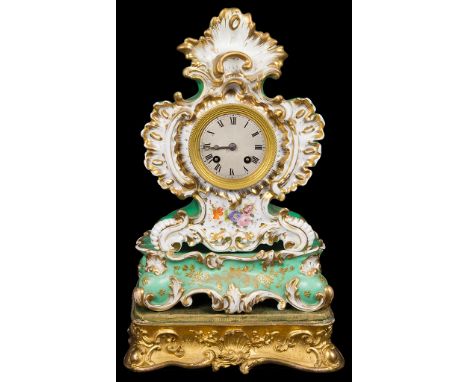 A Henry Marc French Ceramic Mantel Clock:The ornate gilt and floral design clock with green ground, with separate matching ce