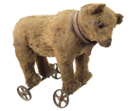 A Steiff Mohair Bear:Circa 1908 with black boot button eyes, black stitched nose, mouth and claws, with a swivelling head, st
