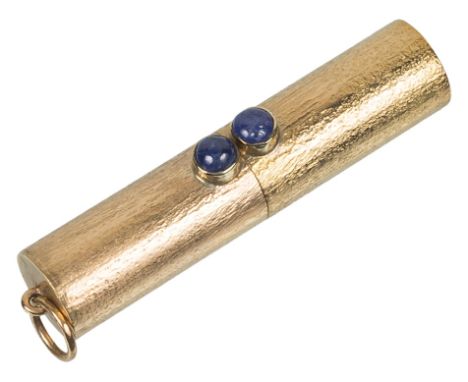 A Gold and Sapphire Set Pill Box:The twist action opening to release pills set with two cabochon sapphires   CONDITION REPORT