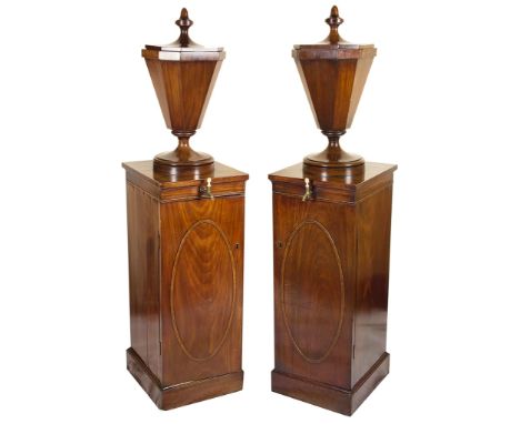 A Pair of Wine Cisterns:George III, mahogany, each cistern in the form of a fluted urn vase, on a rectangular crossbanded ped