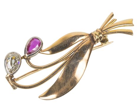 A 14k Gold Diamond and Ruby Brooch:The pear shaped diamond approx. 0.80ct, the Ceylon Ruby approx 0.30cts
