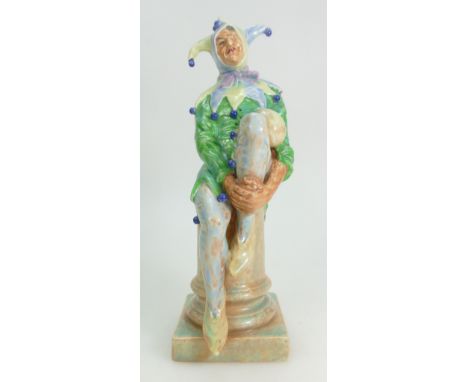 Royal Doulton prototype earthenware figure The Jester, painted in shades of green, blue and yellow with marbled pedestal, imp