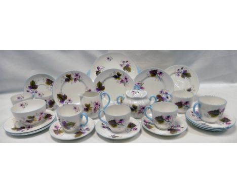 A Shelley Floral tea service comprising - seven cups and saucers, side plates, milk jug, sugar bowl and bread and butter plat