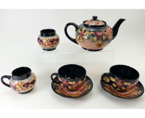 Moorcroft Teaset decorated in the Oberon design dated 1993, comprising teapot, sugar, milk jug and two cups and saucers, in o