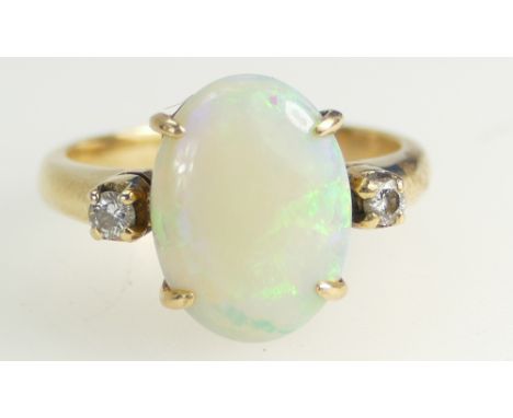 18ct Gold Ladies Ring set with a large Opal stone (approx 5ct) set with two diamonds, size K/L, 5 grams