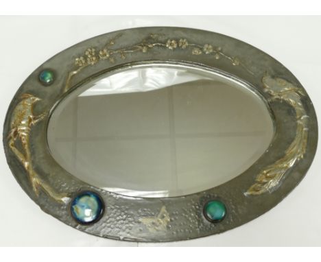 Arts and Crafts embossed Pewter framed oval mirror with Ruskin style high fired ceramic medallions, depicting exotic birds an