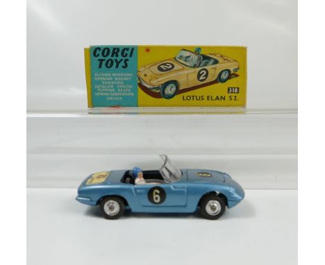 Corgi 318 Light Blue Lotus Elan S2 in near mint condition complete with driver and transfers and in original excellent condit