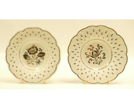 Wedgwood shaped plate decorated with silver lustred decoration of flowers, diameter 22cm and another similar plate with a dif