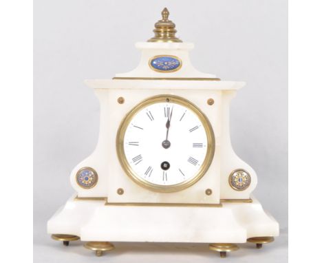 A late 19th century French alabaster mantel clock of cantered rectangular form, the white enamel dial with black roman numera