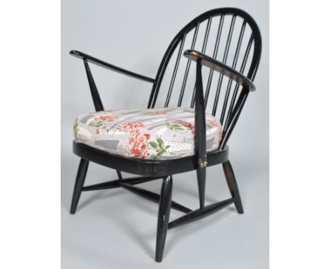 Lucian Ercolani Ercol model 176, a rare 1950's beech and elm lounge chair with hoop back, sprung webbing and deep cushion, al