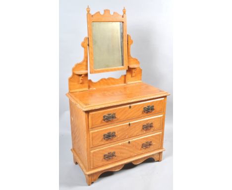 A Victorian pine dressing table with original paint work, the swing mirror above three long drawers, on bracket feet, overall