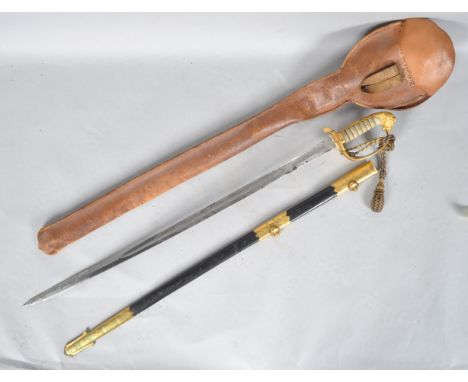 A 19th century Naval Officer's sword with shagreen and gilt pommel, solid guard with attached tassel and folding lock, set a 