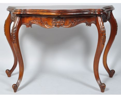 A 20th century mahogany console table of shaped form with carved frieze on carved cabriole legs, 64.5m high x 110cm wide x 49