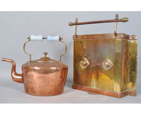 A 19th century copper and brass kettle with glass insulated handle and a copper and brass firescreen