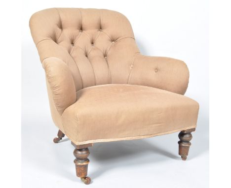 A Victorian button back nursing chair on turned legs and ceramic casters, 77cm wide
