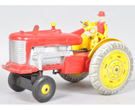 A combination tin plate battery operated reversible tractor toy, 16cm high x 27cm wide